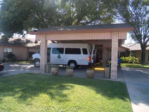 Front exterior of La Vida Serena Nursing and Rehabilitation with a white van at the entrance