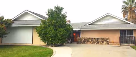 Front exterior of Mam Family Home with entrance and landscaping
