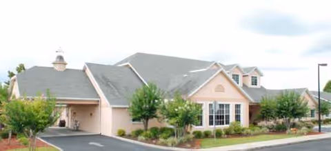 Exterior view of Brookdale South Bay senior living facility with manicured landscaping and a front driveway.