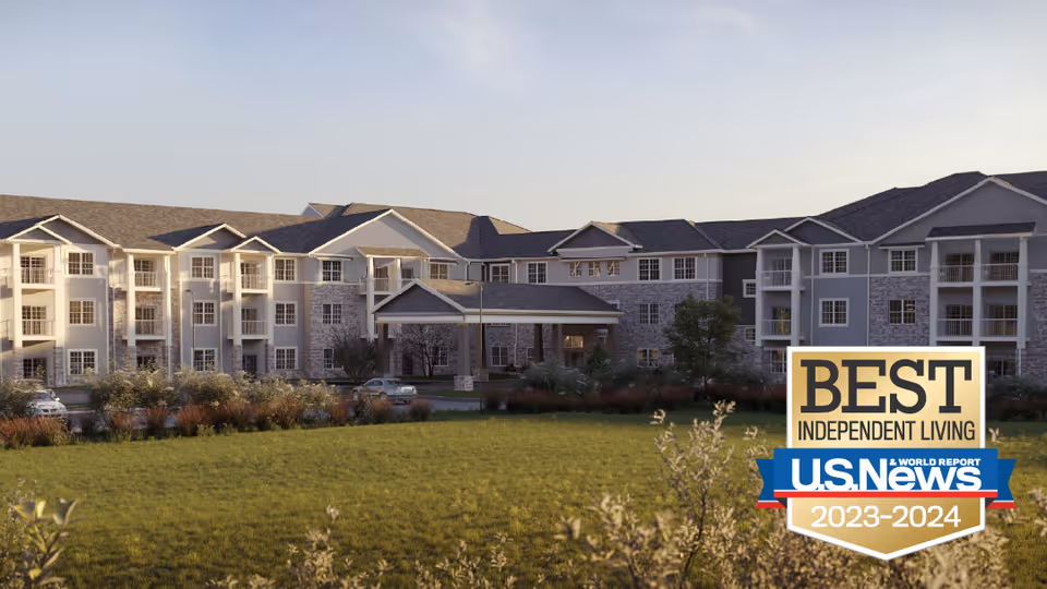 Front exterior of a large senior living facility with a lawn and a 'Best Independent Living' award badge overlay.