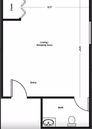 Architectural floor plan showing a studio layout with an entry, a combined living and sleeping area measuring 11 feet 7 inches by 12 feet 0 inches, a closet, and a bathroom with a sink and toilet.