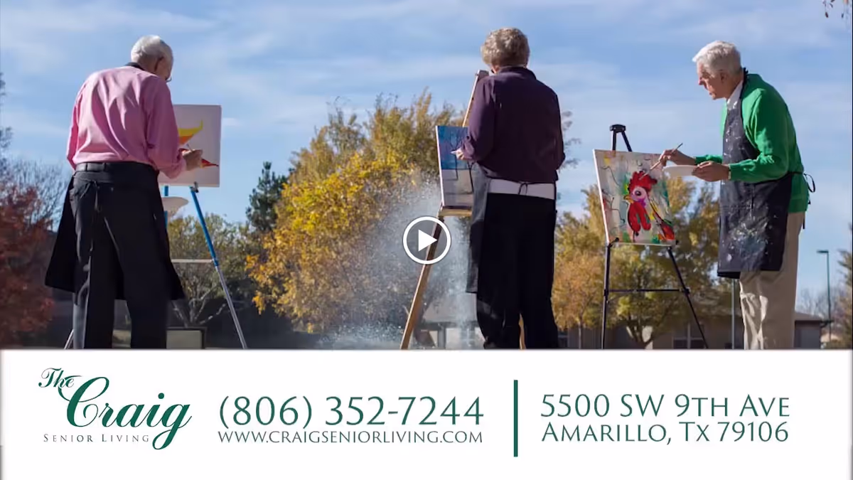Three elderly individuals painting on easels outdoors on a sunny day with trees in the background.