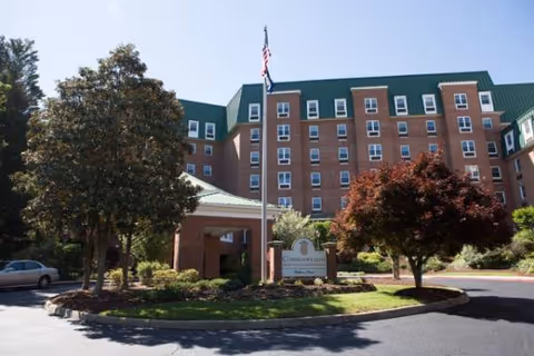 Exterior view of Stratford Rehabilitation Center with brick facade and green roof.