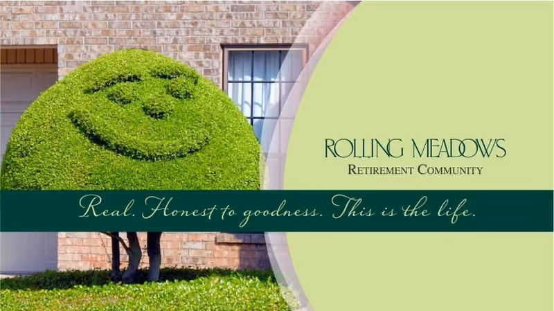 A smiling bush in front of a brick building with windows, featuring the name Rolling Meadows Retirement Community.