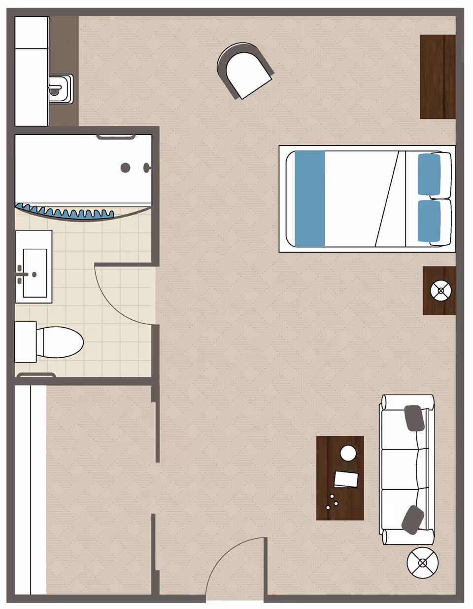Floor plan of a studio apartment featuring a combined living and sleeping area with a bed, sofa, coffee table, two side tables with lamps, and a chair. The unit includes a separate bathroom with a toilet, sink, and shower, and a small kitchenette area with a sink.
