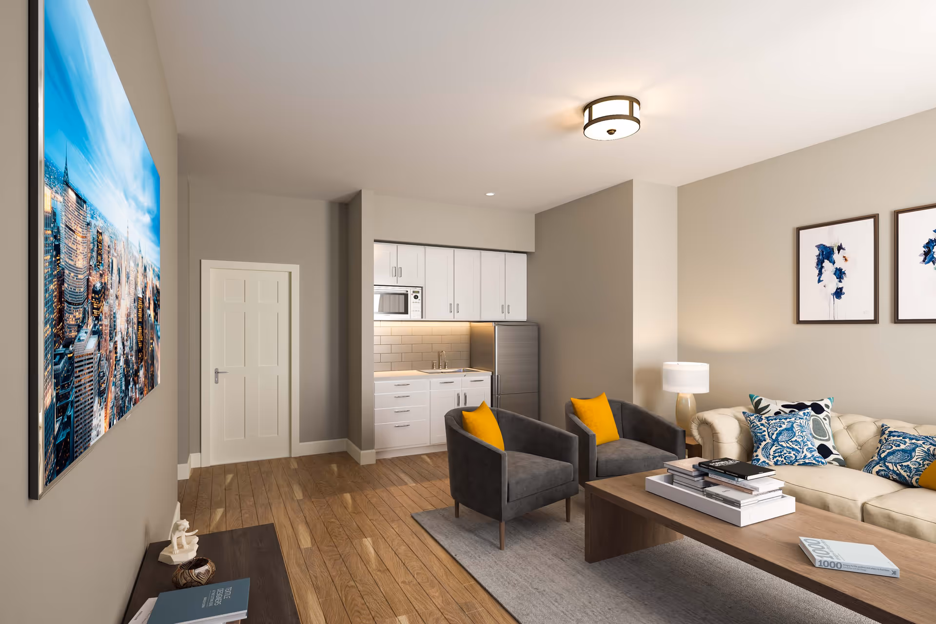 Modern living room with a sofa, two armchairs with yellow pillows, a coffee table, and a small kitchenette in the background.