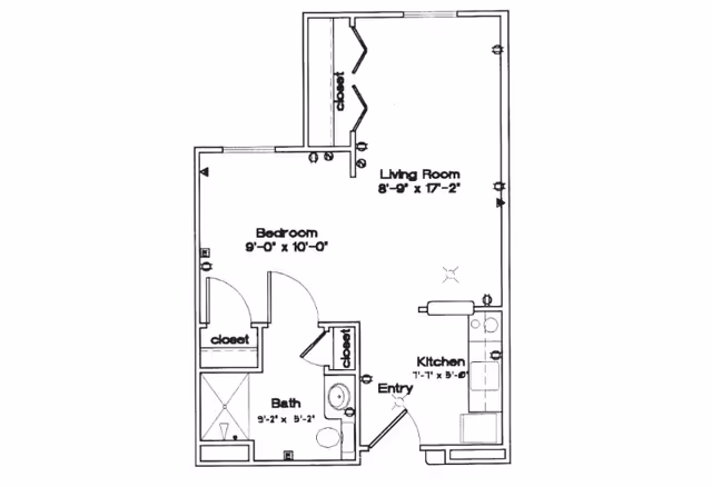 Black and white architectural floor plan of a one-bedroom apartment at Sycamore Manor, showing a bedroom, bathroom, kitchen, living room, closets, and an entry area with dimensions labeled.