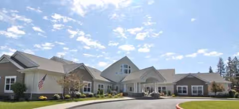 Brookdale Nine Mile senior living facility exterior featuring a wide entrance and manicured lawn.
