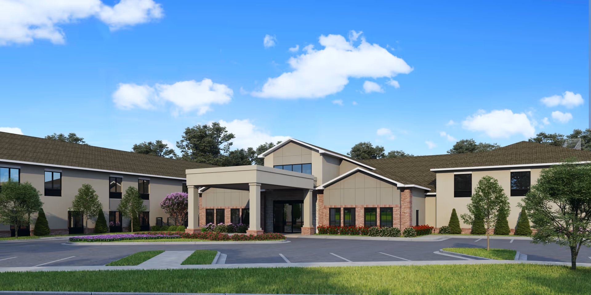 Exterior view of Eden at Crestview Assisted Living and Memory Care facility showing a modern two-story building with a covered entrance, surrounded by landscaped greenery and a parking area under a blue sky with scattered clouds.