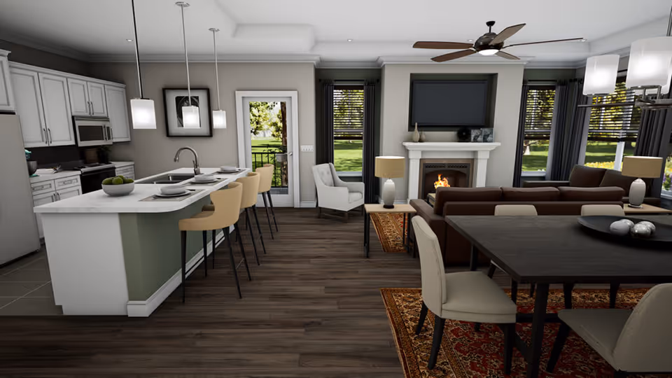 Open-plan interior showing a kitchen island with stools, a dining table, and a living area with a sofa and fireplace.