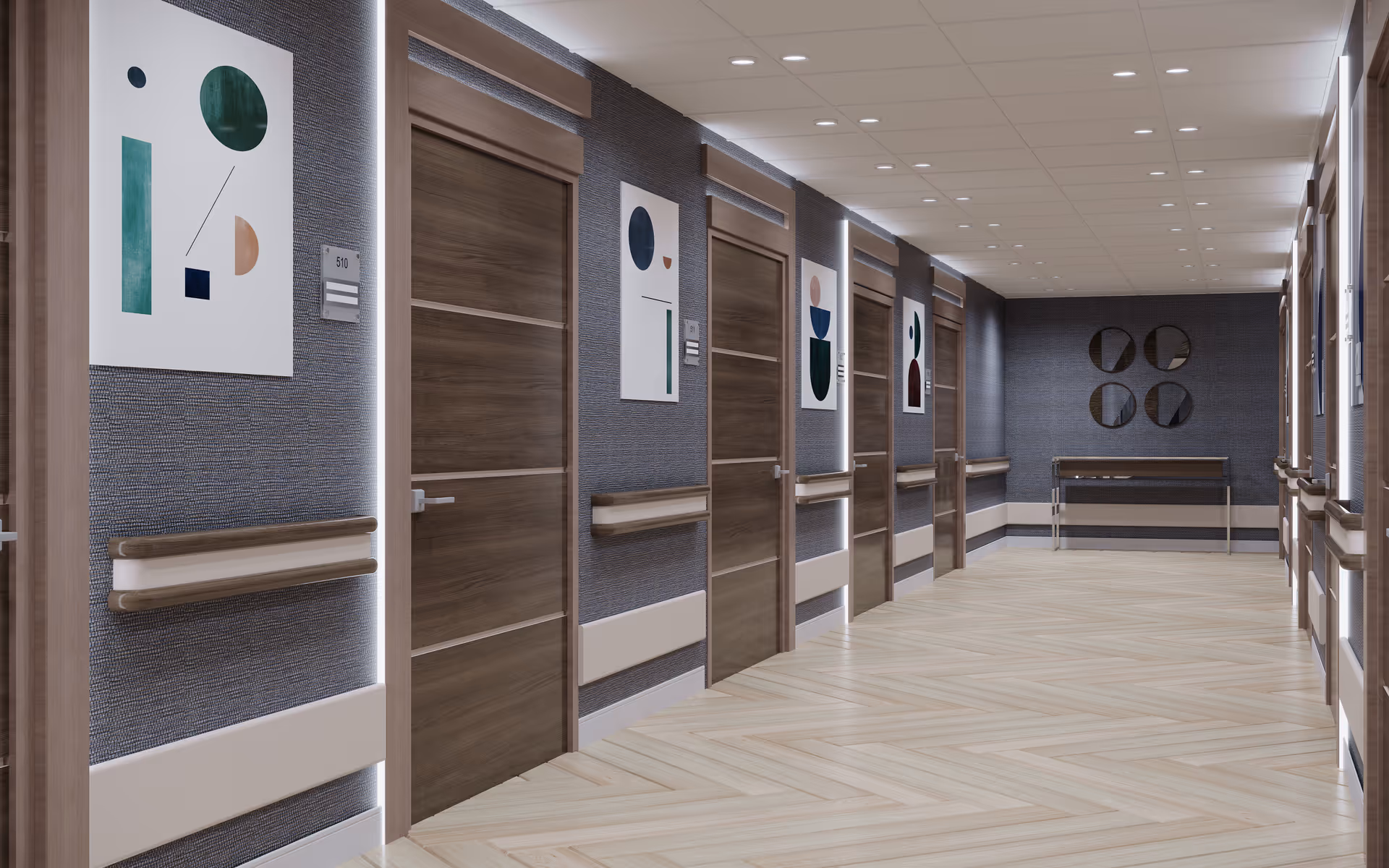 Long, well-lit interior hallway with multiple wooden doors, handrails and abstract wall art.