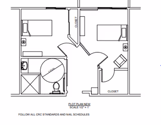 Architectural floor plan showing two bedrooms, a bathroom with a shower and toilet, closets, and connecting doors. The plan includes measurements and labels for closets and fixtures.