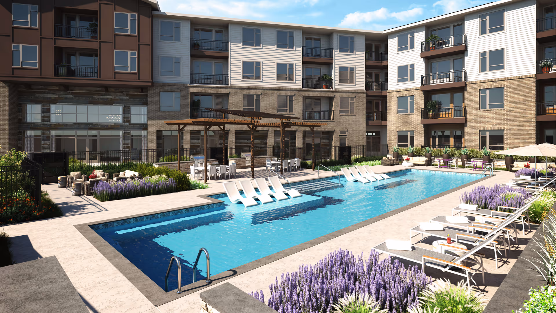 A swimming pool area with lounge chairs and landscaped gardens in a senior living facility.