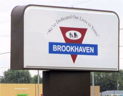 Exterior Brookhaven Nursing & Rehab sign with blue banner