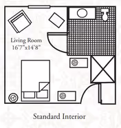 Floor plan layout of a standard interior unit at Heritage Menomonee Falls showing a living room measuring 16 feet 7 inches by 14 feet 8 inches, with furniture placement including a bed, chairs, and tables, along with a bathroom area containing a sink, toilet, and shower.
