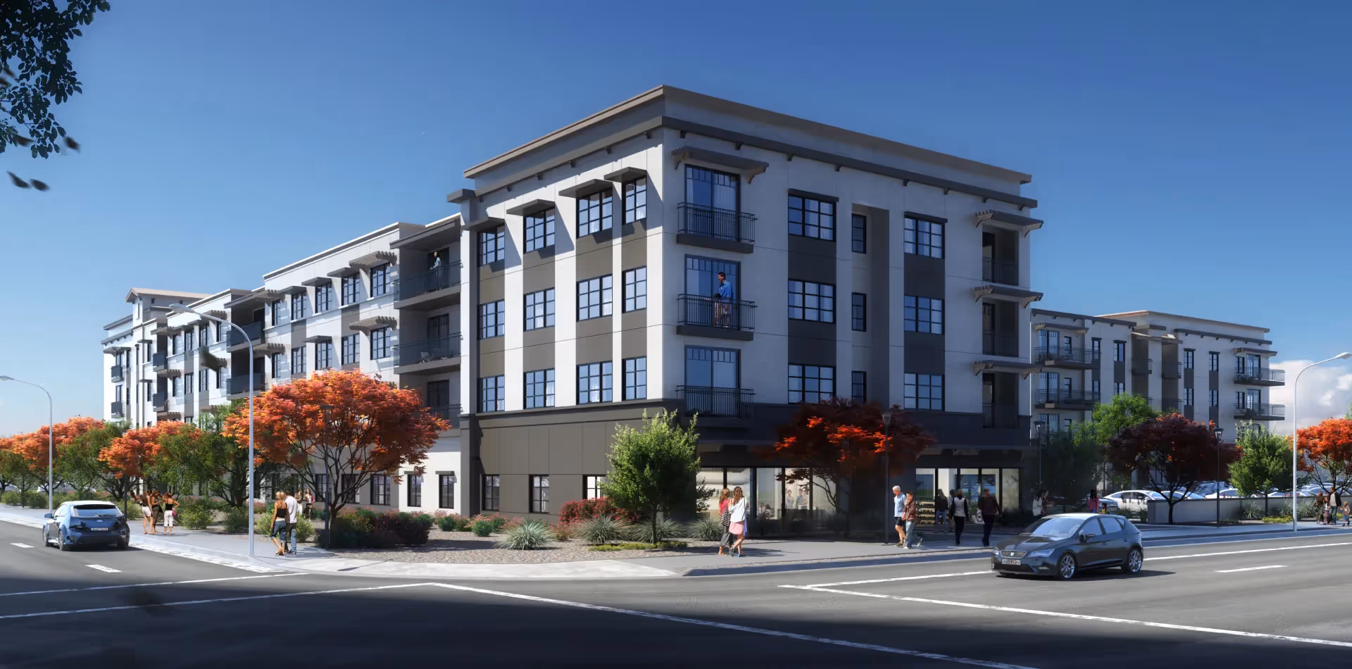 Street view of a modern multi-story senior living building with balconies, trees, pedestrians, and cars under a clear blue sky.