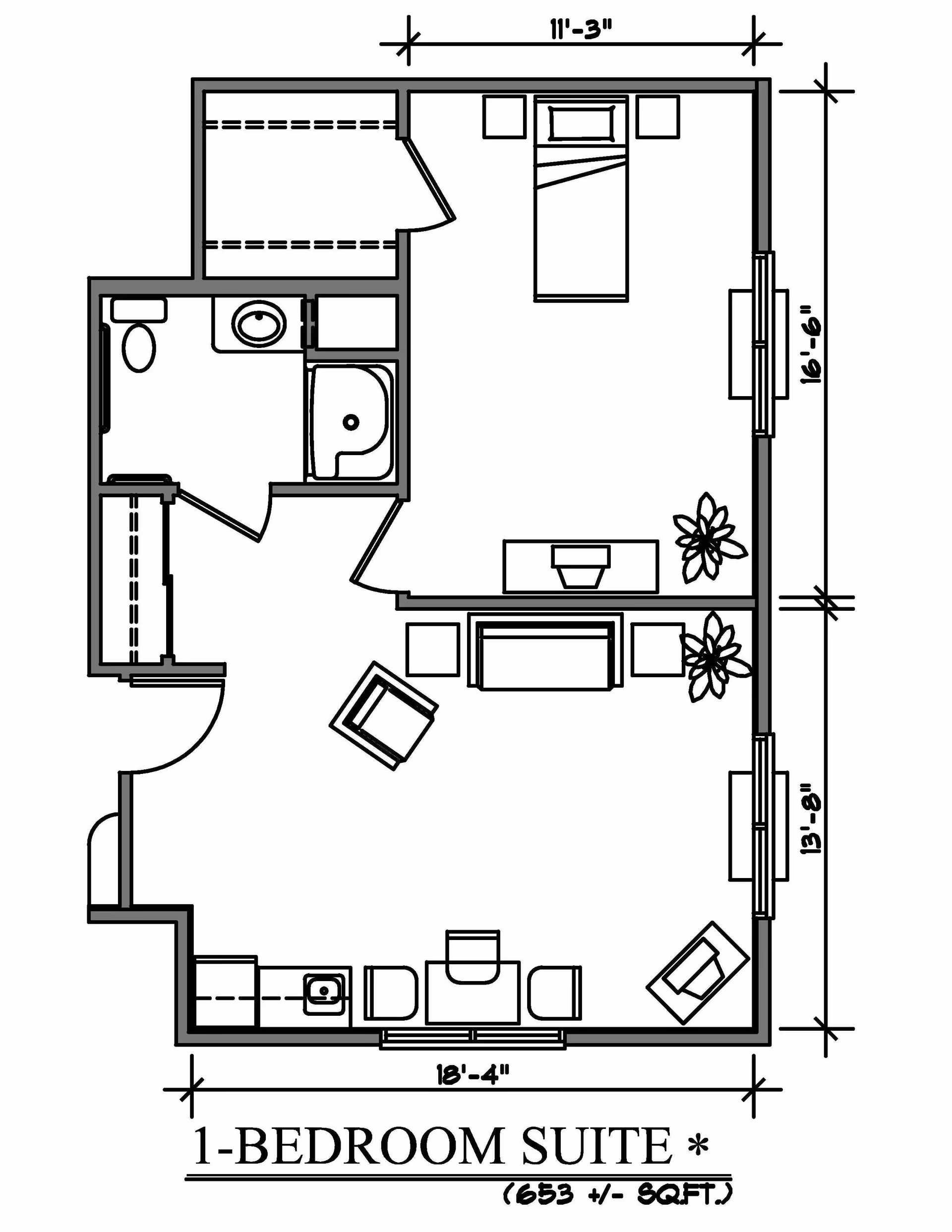 Architectural floor plan of a 1-bedroom suite showing a bedroom with a bed and nightstands, a living area with seating and tables, a bathroom with a toilet, sink, and bathtub, and a small kitchenette area. Dimensions and furniture layout are included.