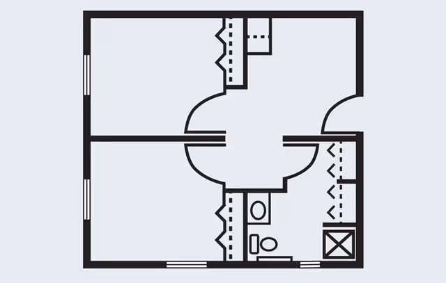 Architectural floor plan showing a layout with multiple rooms including a bathroom with a toilet and shower, closets, and entryways.