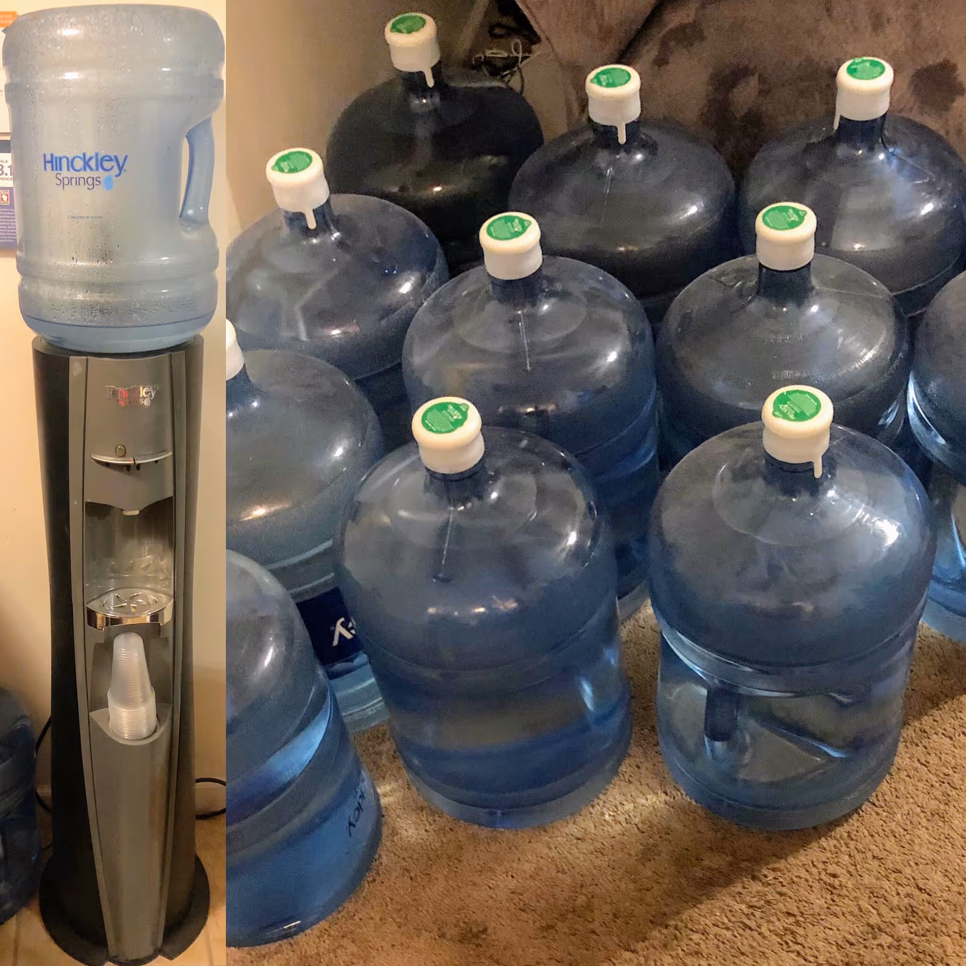 A water cooler with a large water bottle labeled Hinckley Springs on top, next to multiple large empty water bottles with green caps placed on a carpeted floor.
