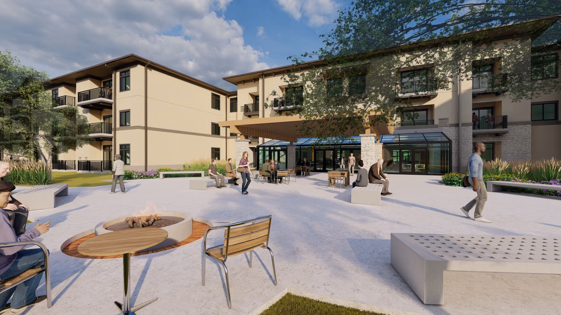 Outdoor courtyard with seating, a fire pit, and people in front of a three-story senior living building.