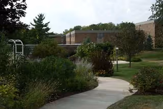 Exterior view of Sanctuary at St Paul's with walkway and landscaped grounds.