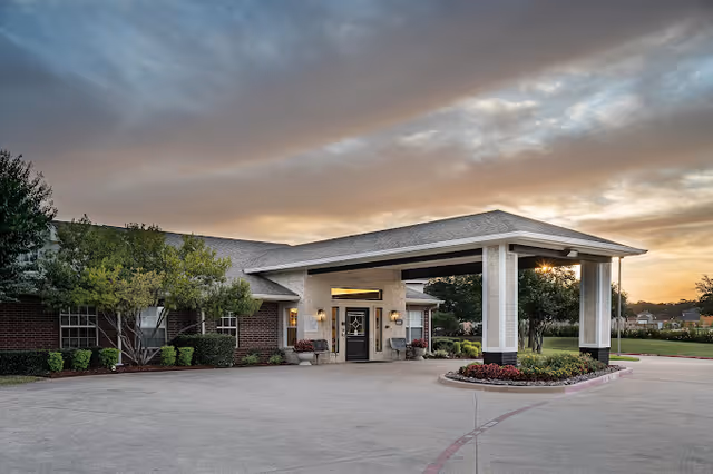 Exterior view of Brookdale senior living facility front entrance with covered porte-cochere.