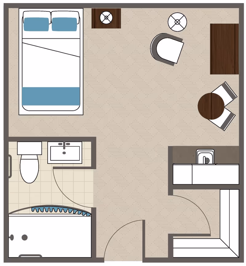 Top-down floor plan of a studio apartment with a bed, bathroom, kitchenette, seating and dining areas, and an entry door.