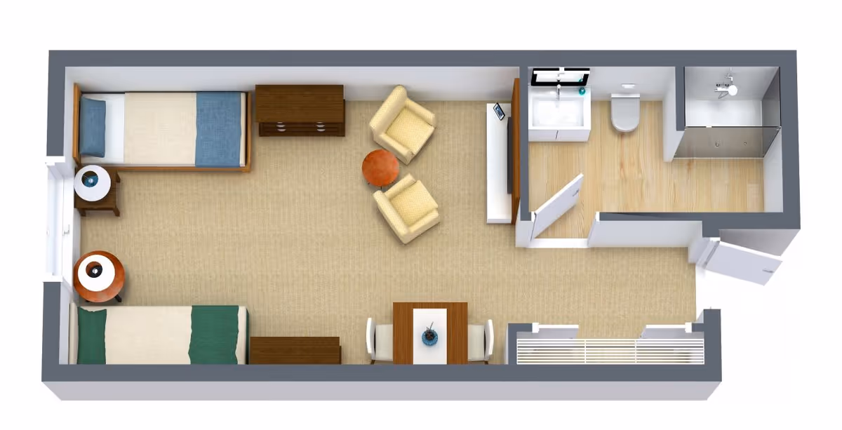 Top-down floor plan of a small living space featuring two single beds with nightstands, a seating area with two armchairs and a small round table, a dining table with two chairs, and a bathroom with a sink, toilet, and shower.