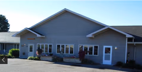 Front exterior of Country Terrace Assisted Living-Altoona with parking and landscaping.