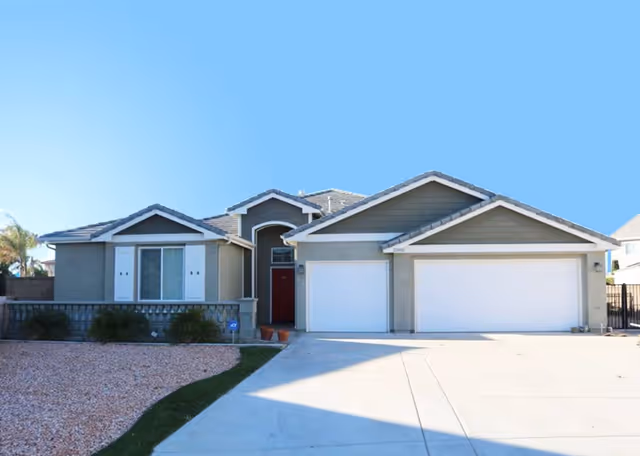 Front exterior of a single-story residence with a two-car garage.