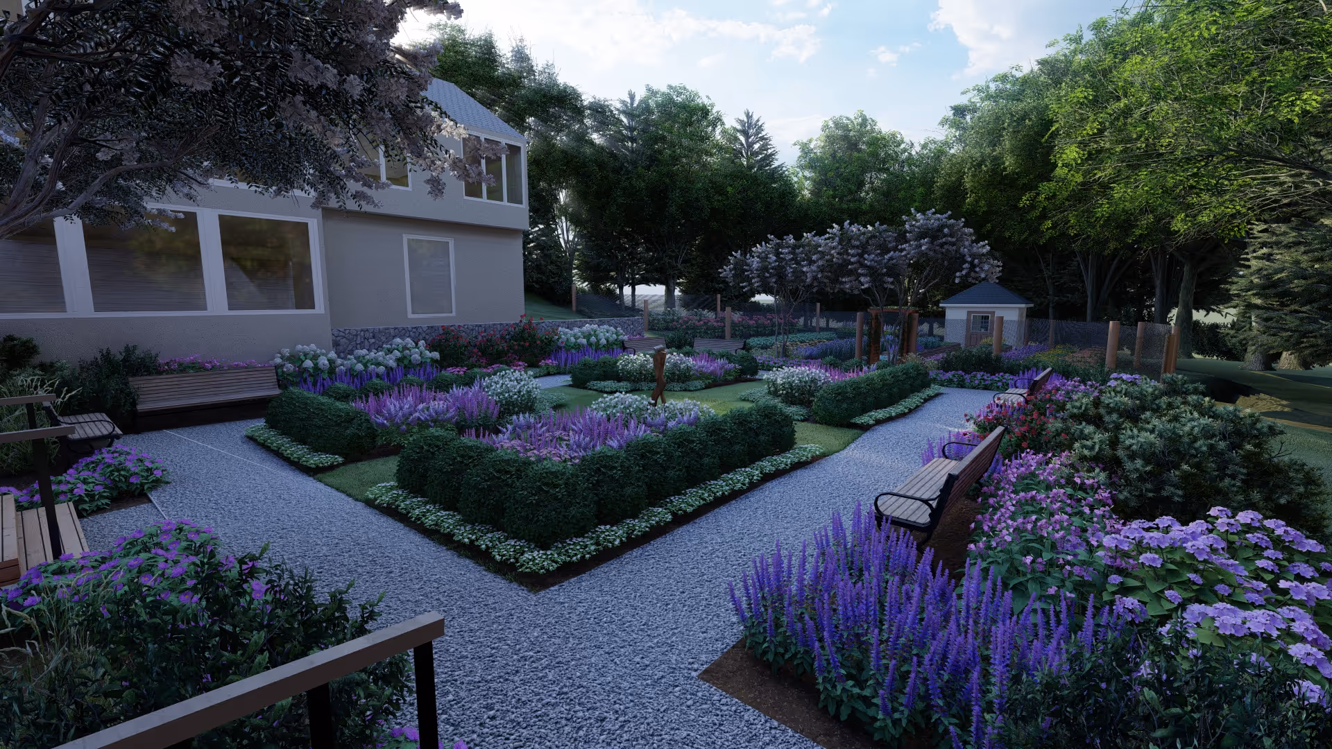 A beautifully landscaped garden area at Rosette Residential Senior Living featuring gravel pathways, wooden benches, and vibrant purple and white flowers. The garden is surrounded by lush green trees and shrubs, with a building visible on the left side and a small shed in the background.
