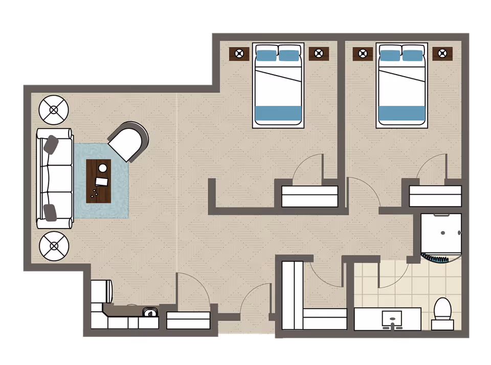 Floor plan of a living space featuring two bedrooms each with a bed and nightstands, a living room area with a sofa, chair, coffee table, and side tables, a kitchen area with a sink and appliances, and a bathroom with a shower, sink, and toilet.