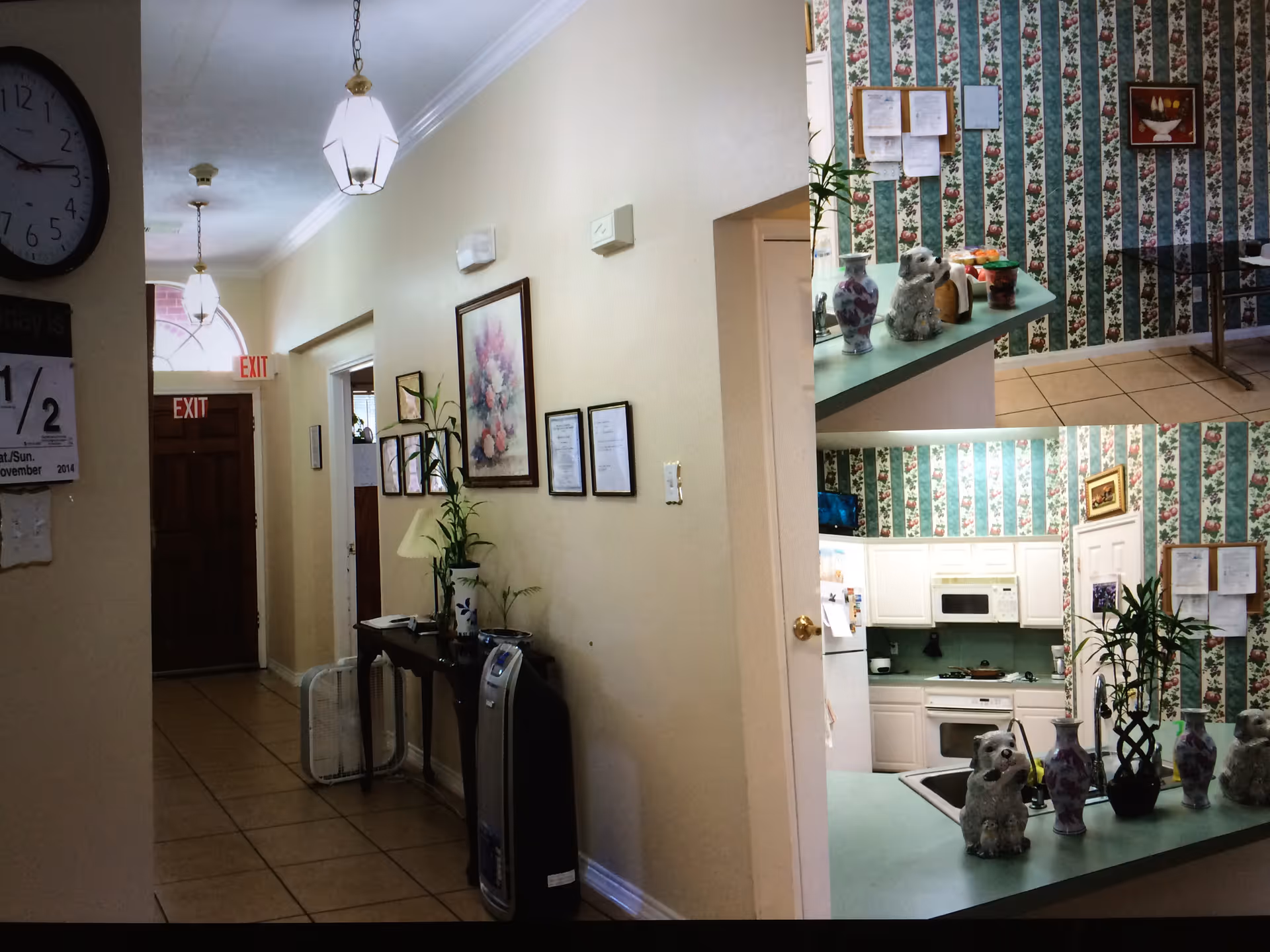 Interior view of a senior care home showing a tiled hallway with framed artwork and plants, and a small kitchenette/counter area with decorative vases.