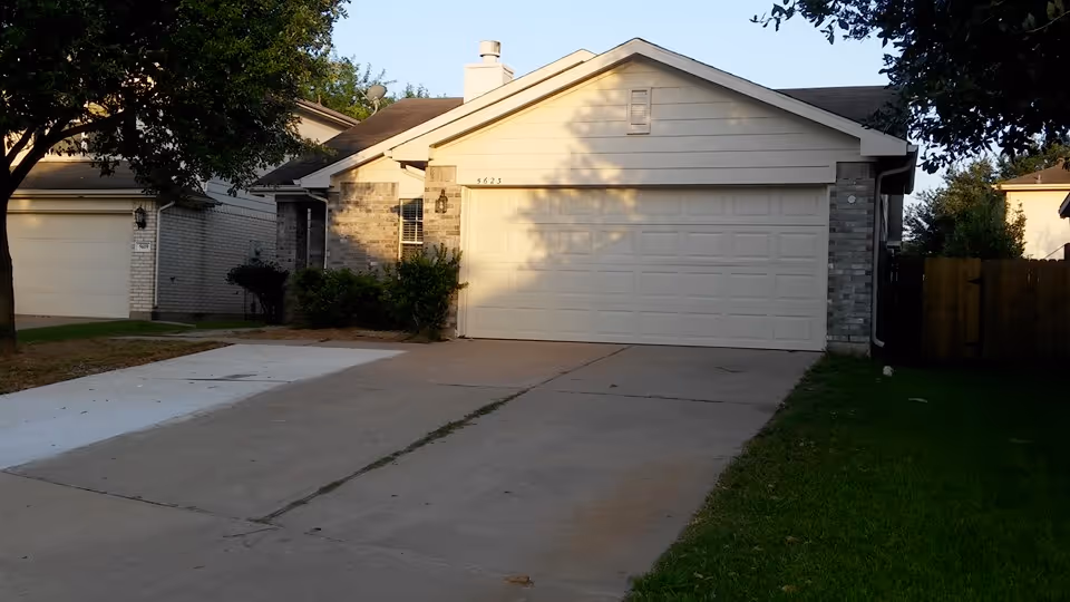 Front view of a single-story assisted living home with a two-car garage