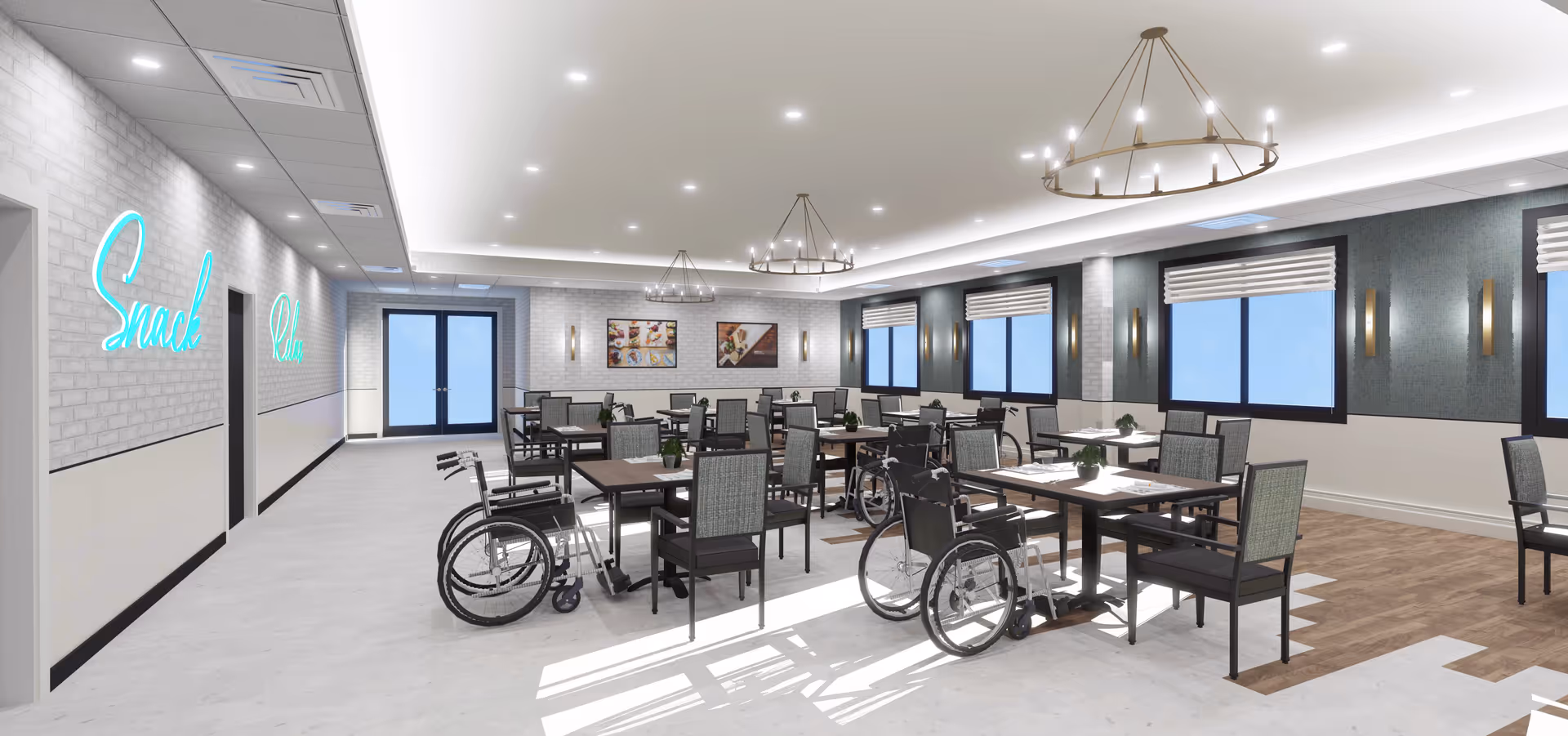 A spacious dining room with multiple tables and chairs, some tables have wheelchairs positioned next to them. The room has large windows with blinds, modern light fixtures hanging from the ceiling, and a neon sign on the left wall that reads 'Snack Club'. The floor has a combination of light and wood-like tiles, and there are framed pictures on the far wall.