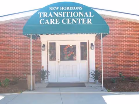 Front entrance of a brick building with teal awning that reads New Horizons Transitional Care Center.