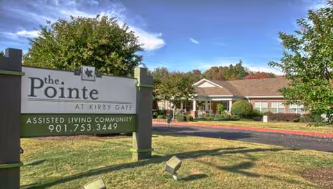 Exterior view of The Pointe at Kirby Gate sign in front of the facility.