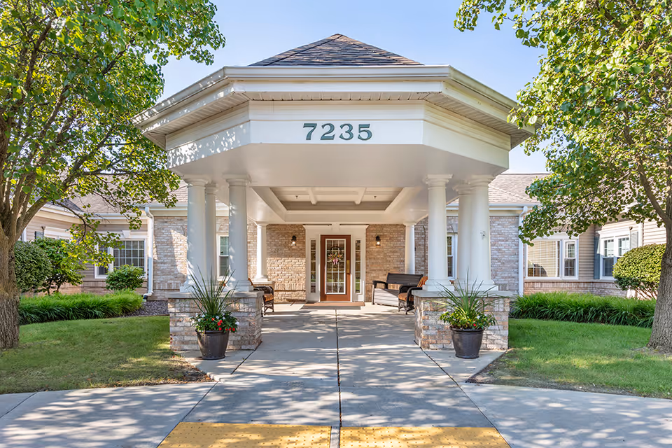 Front entrance of Brookdale Delta senior living facility at 7235, with columns and a covered walkway.