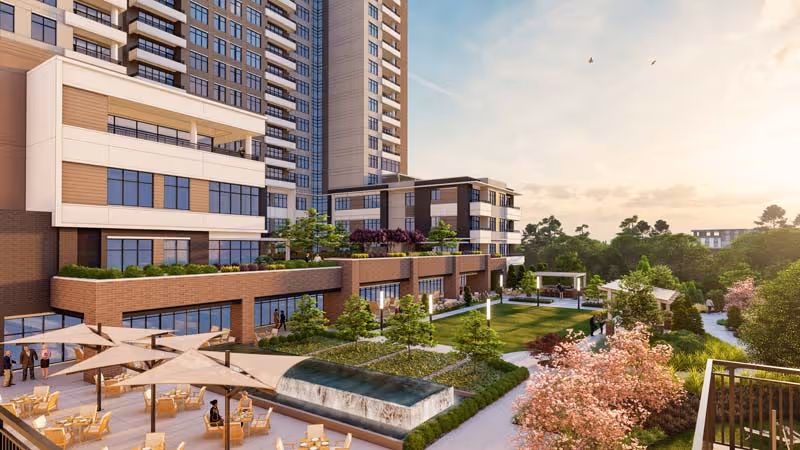 Modern multi-story senior living building with terraces overlooking a landscaped courtyard, fountain, and outdoor seating areas.