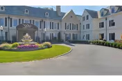 Glengariff Rehabilitation and Healthcare Center exterior with circular driveway and fountain.