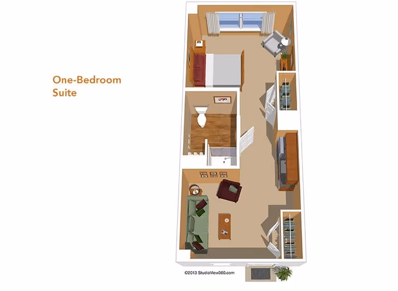 3D floor plan of a one-bedroom suite showing a living room with sofa and chair, a bathroom with toilet and shower, and a bedroom with bed and armchair.