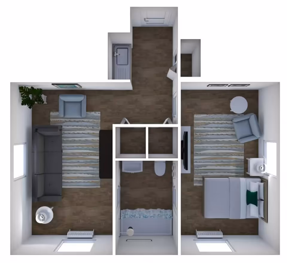 Top-down view of a small apartment floor plan showing a living room with a sofa, armchair, rug, and side table; a kitchen area with a sink; a bathroom with a shower, toilet, and sink; and a bedroom with a bed, armchair, rug, and side table.