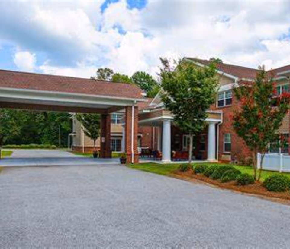 Front exterior view of Spring Oak at York with brick building and entrance columns.