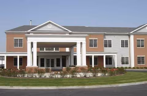 Exterior view of Kingston Care Center of Sylvania with brick facade and portico entrance.