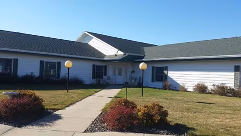 Single-story Prairie View Healthcare Center exterior with a walkway and landscaped front yard.