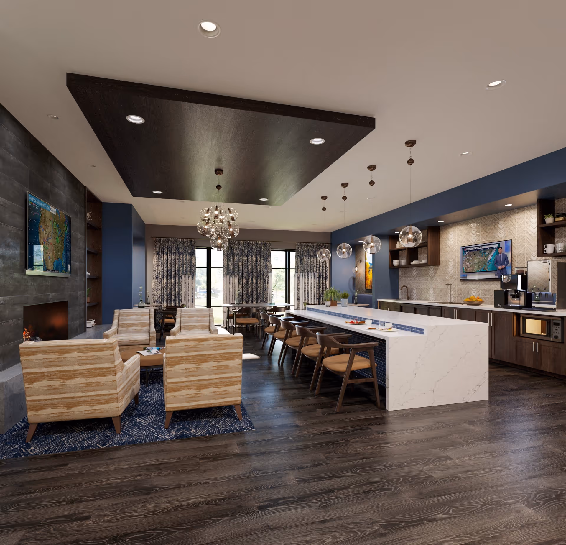 A modern common area in a senior living facility featuring a seating area with four beige armchairs around a small table on a blue patterned rug, a large white kitchen island with wooden bar stools, pendant lights hanging above, and a kitchen area with cabinets, a microwave, coffee machines, and a wall-mounted TV displaying a weather forecast. Large windows with patterned curtains allow natural light into the room.