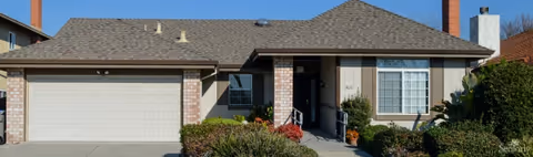Single-story residential front exterior of Cataldi Manor RCFE with garage and entrance.