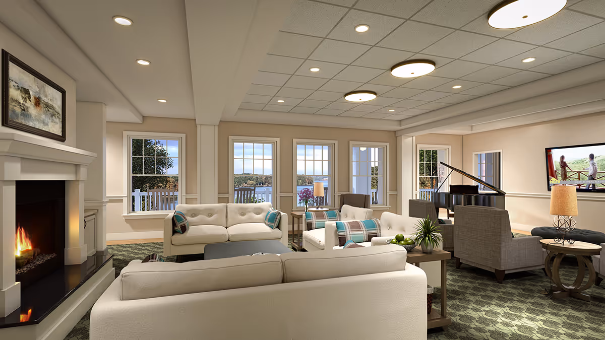 Spacious, well-lit lounge with sofas and armchairs arranged around a fireplace, a grand piano, and large windows overlooking a waterfront.