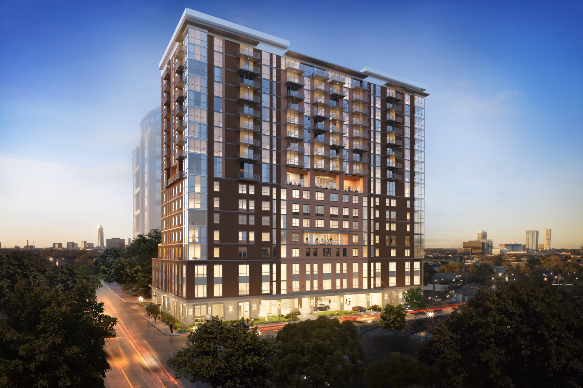 Exterior view of a multi-story modern residential building at dusk with illuminated windows and balconies in a city setting.