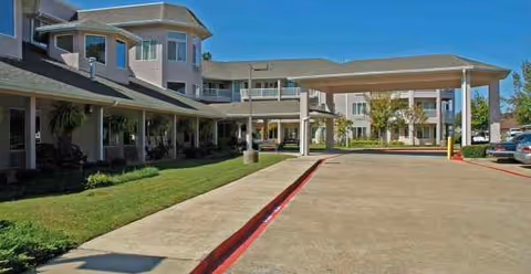 Exterior view of Asher Point Independent Living of Texarkana with entrance and driveway